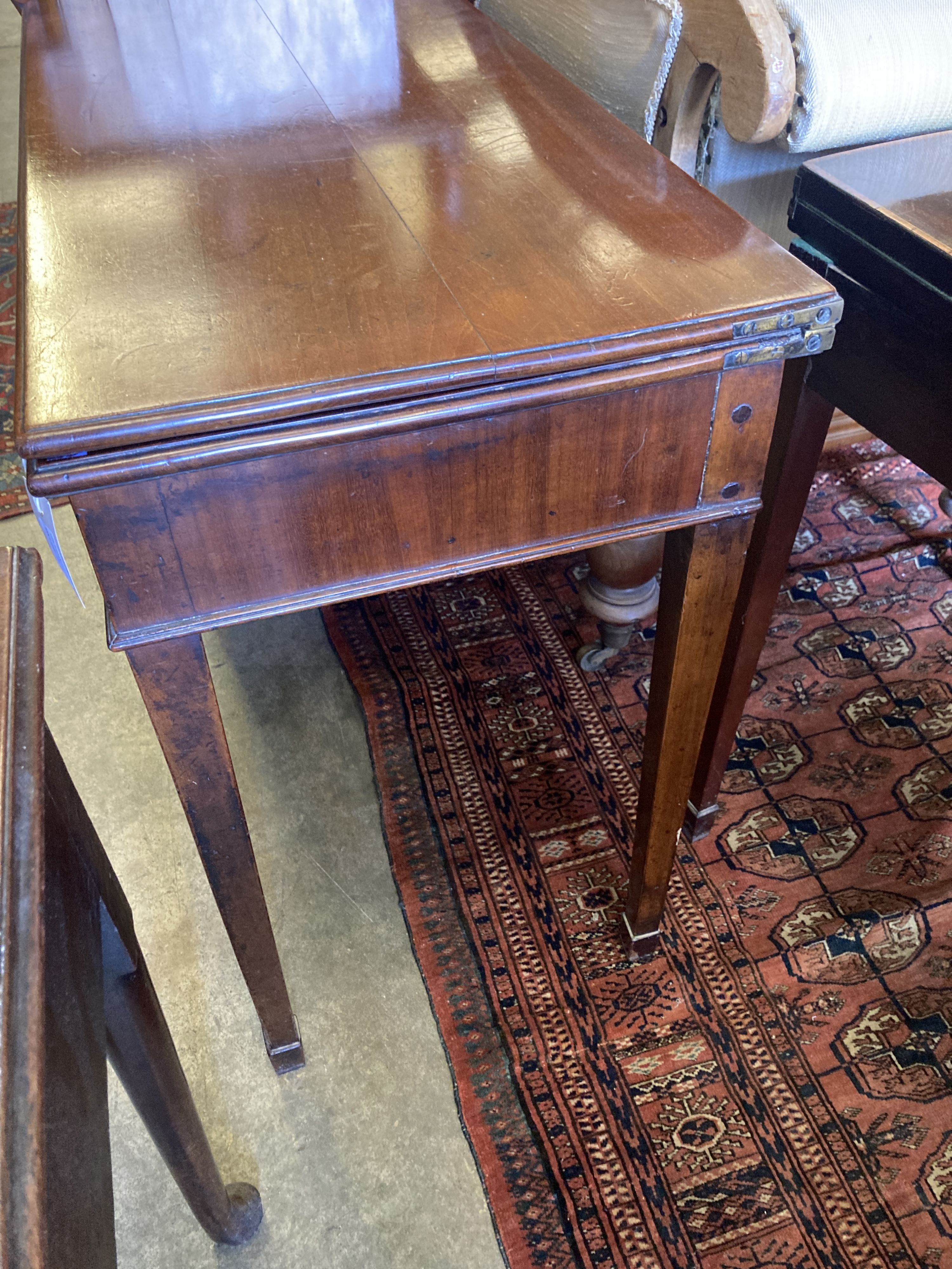 A George III rectangular mahogany folding tea table, width 91cm, depth 44cm, height 73cm